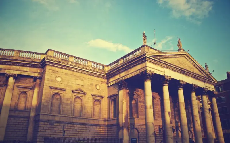 Exterior of a bank building with stone columns