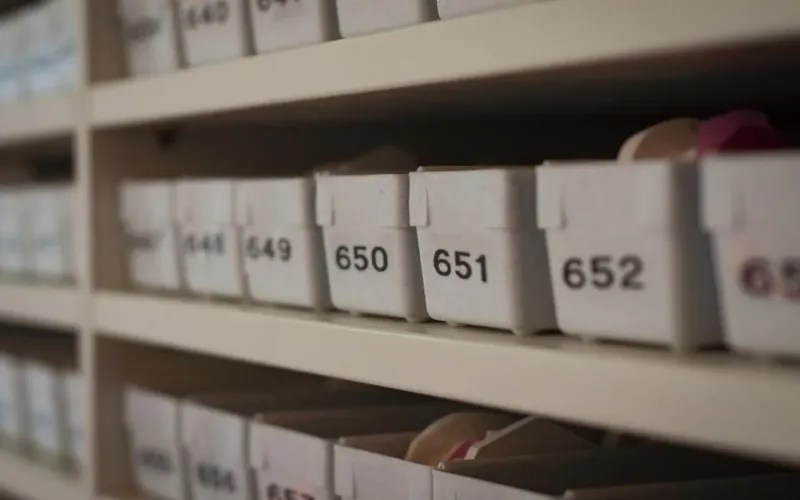 Rows of numbered storage bins on warehouse shelving